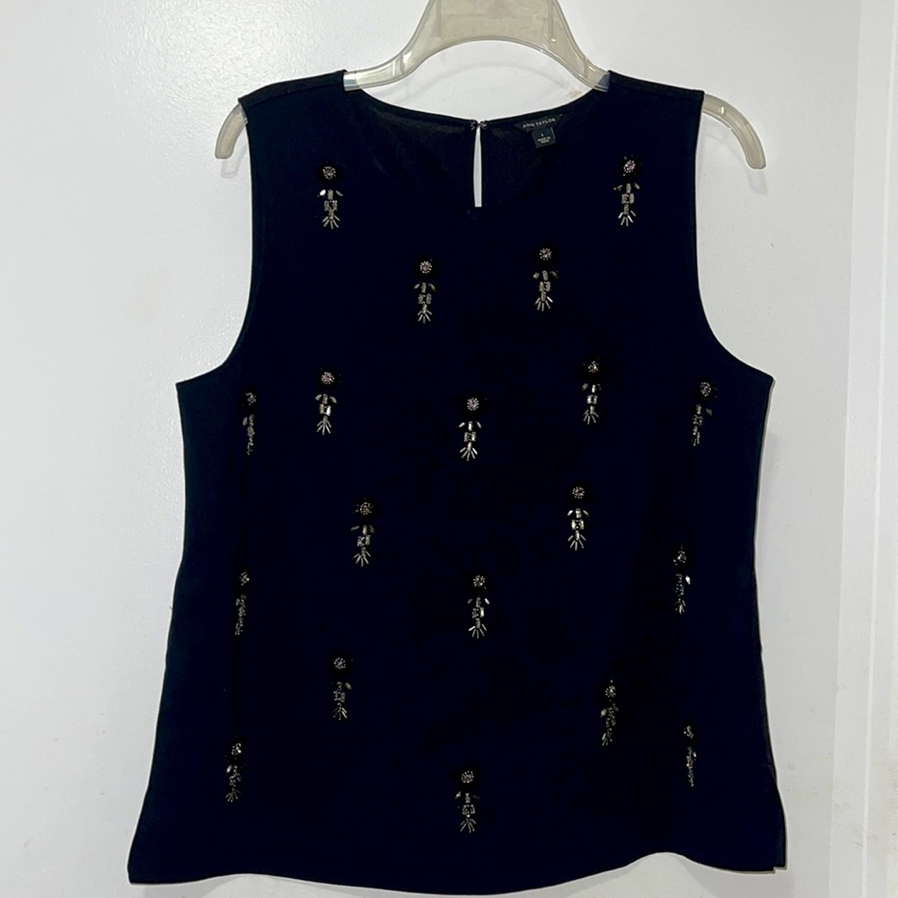 Shell- embroidered with shiny beads.